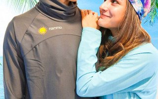 on tropical beach with nammu sun protective swim hats
