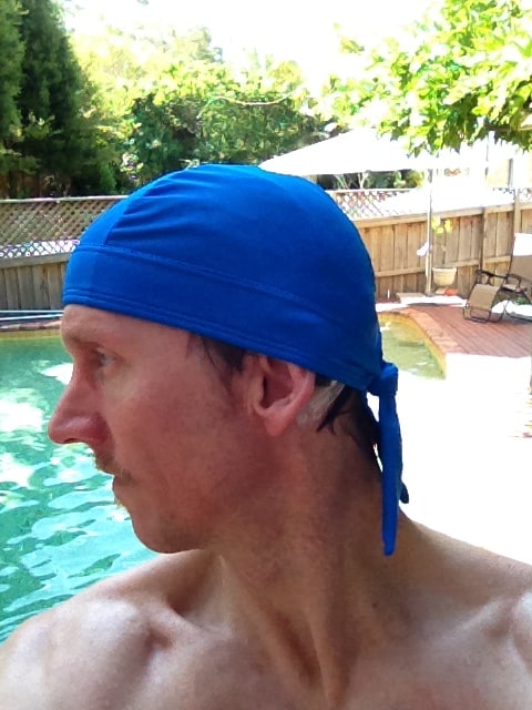 man with cochlear implants swim cap in the pool