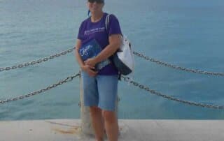 on a cruise ship with blue chemo hat