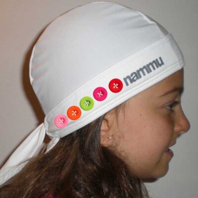 white nammu sun protective swim cap decorated with buttons