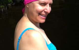 woman pink chemo swim hat