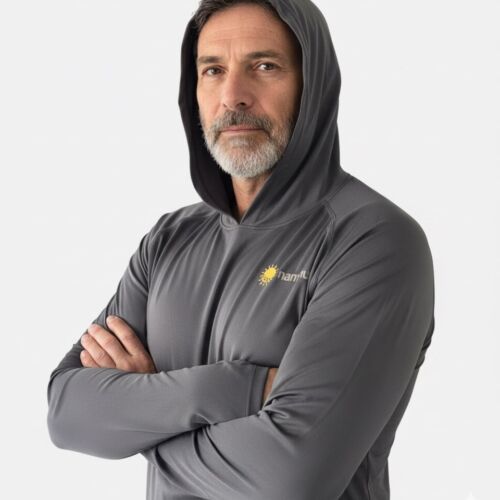 a man wearing gray sun protective swim shirt with hood