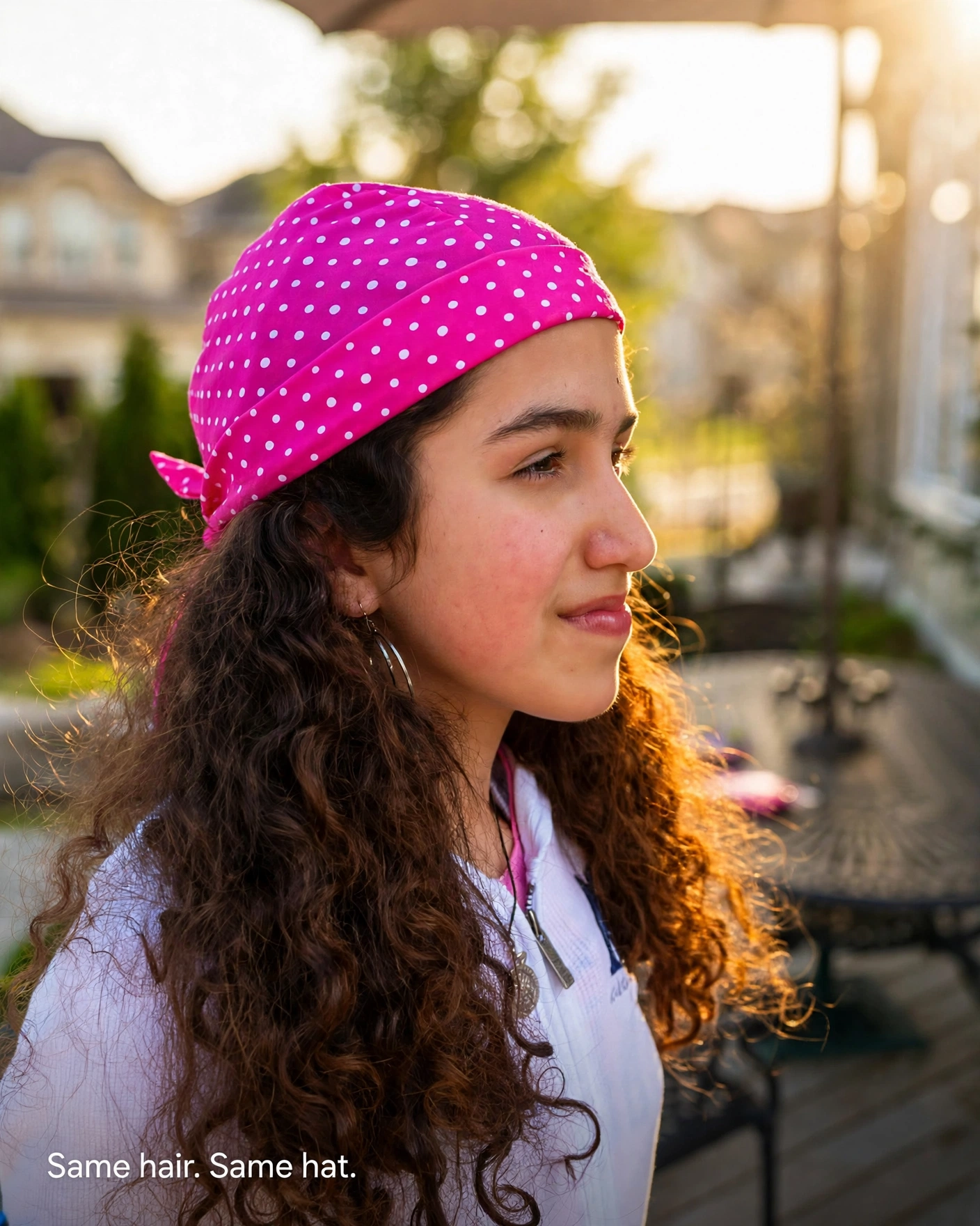 woman with long curly hair wearing a Nammu polka dot sun protective swim hat outdoors