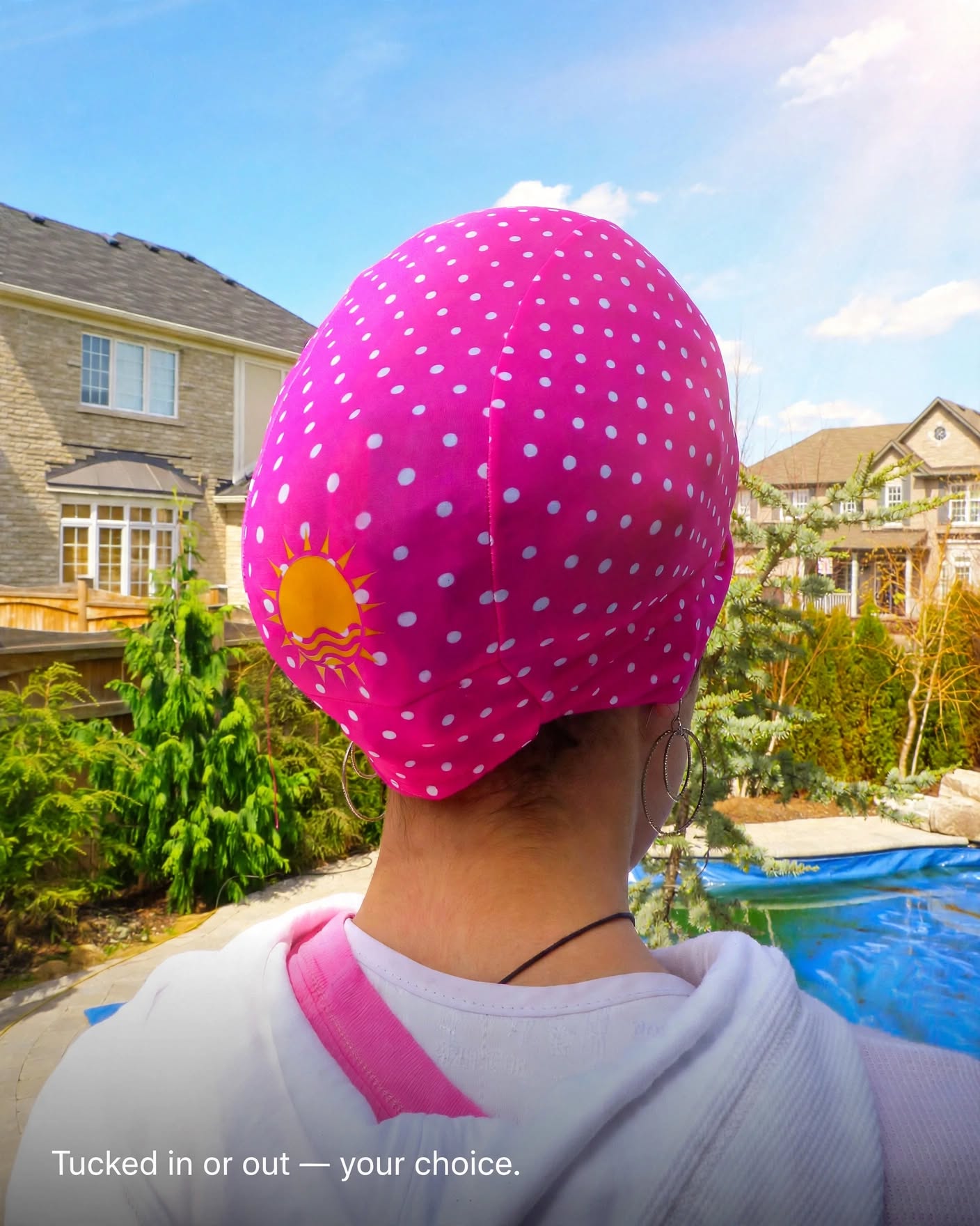 back view of a Nammu sun protective swim hat fitting over long hair, tucked in